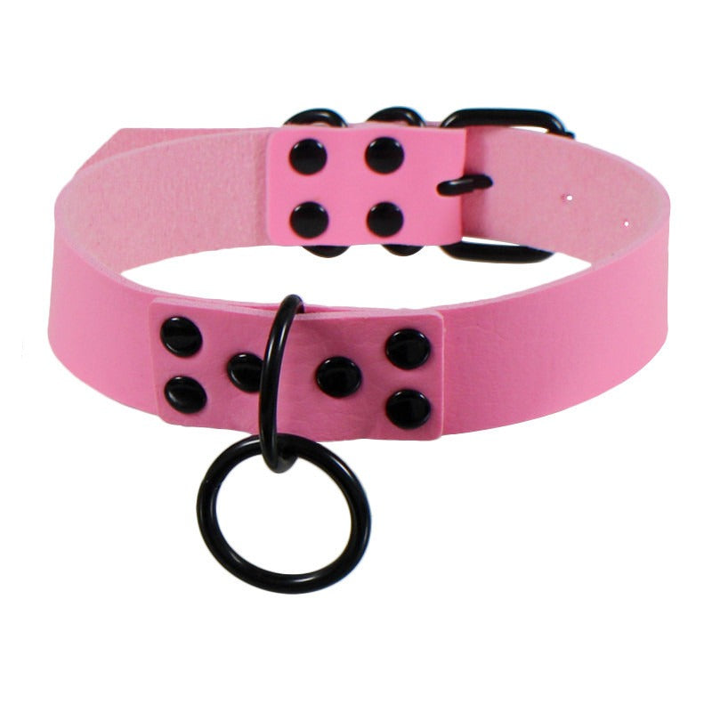 Stylish pink faux leather choker collar with black studs and ring for unisex bondage fashion.