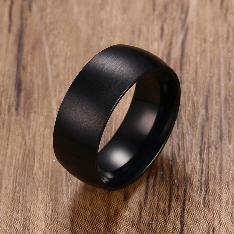 Classic black stainless steel ring with a matte finish, perfect for engagements or as a stylish accessory.