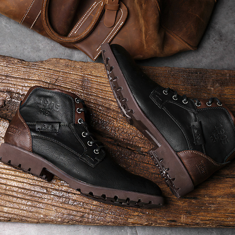 Stylish men's ankle boots in black and brown leather, perfect for casual wear, featuring a rugged sole and lace-up design.