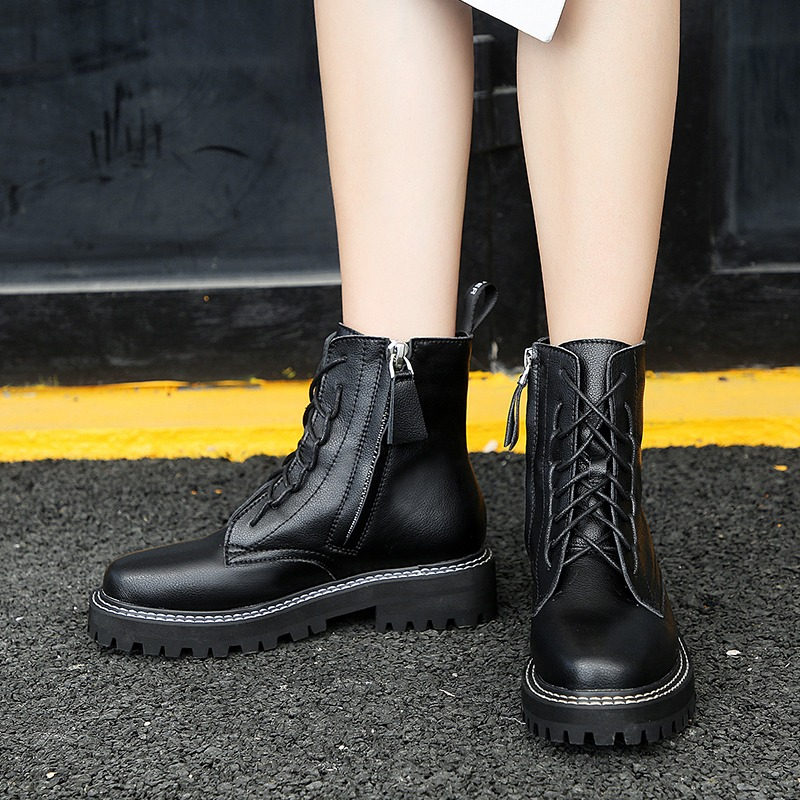 Classic British style women's ankle boots in black PU leather with lace-up design and zipper detail.