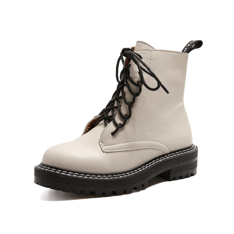 Classic British style women's ankle boots in white with black laces, perfect for casual wear and long walks.