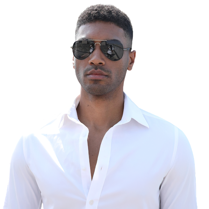 Man wearing classic polarized sunglasses and a stylish white shirt, showcasing casual fashion accessories.