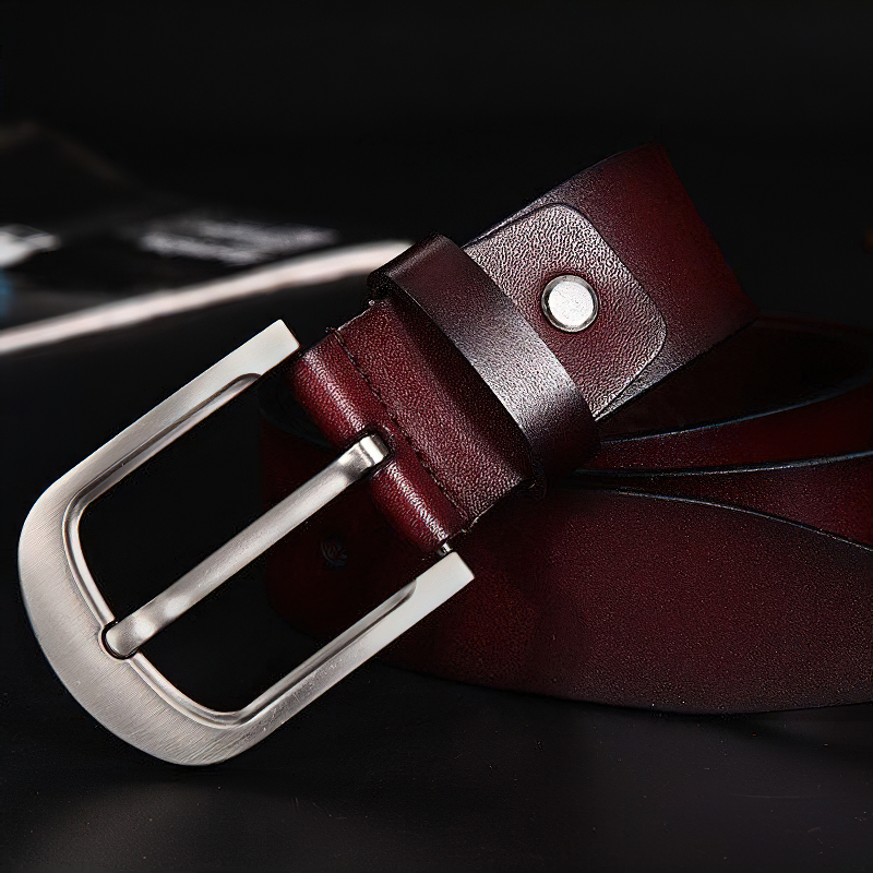 Classic genuine leather belt for men, featuring a durable metal buckle in rich burgundy color.