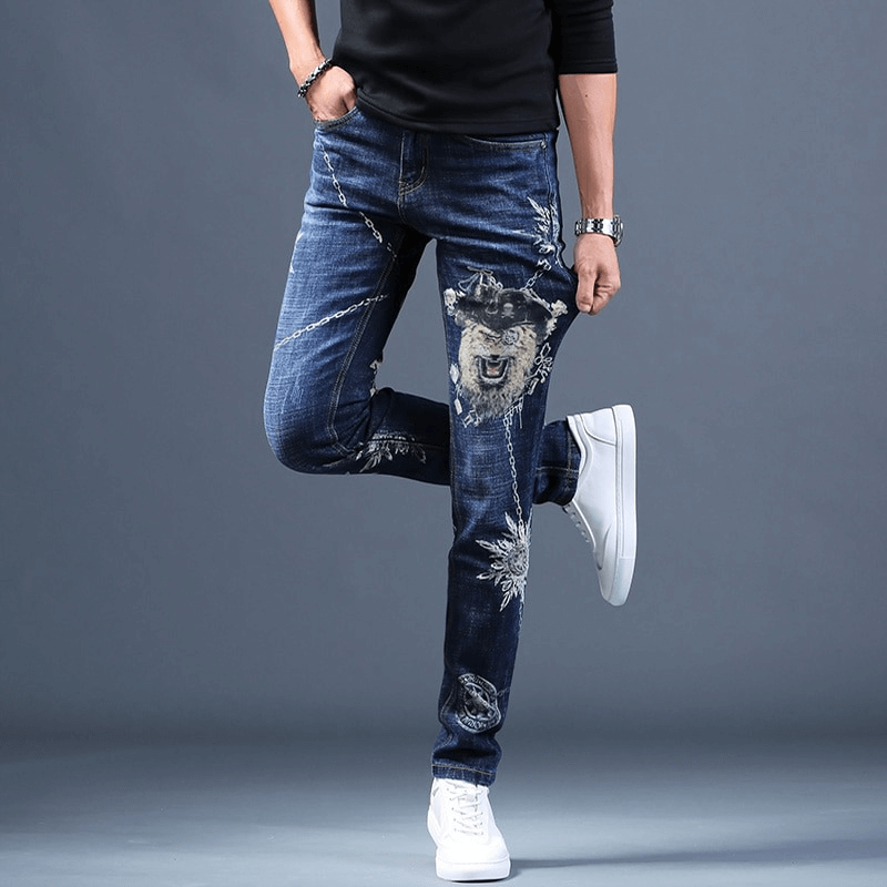 Slim-fit printed jeans for men featuring unique designs, perfect for alternative style fashion.