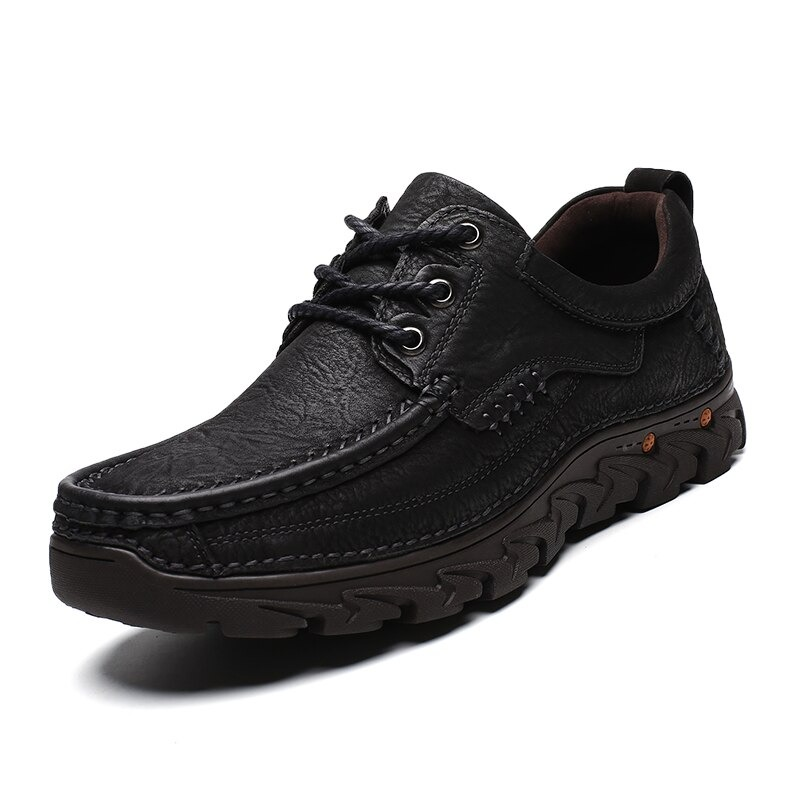 Classic black lace-up men’s leather shoes with textured design, perfect for alternative style wardrobes.