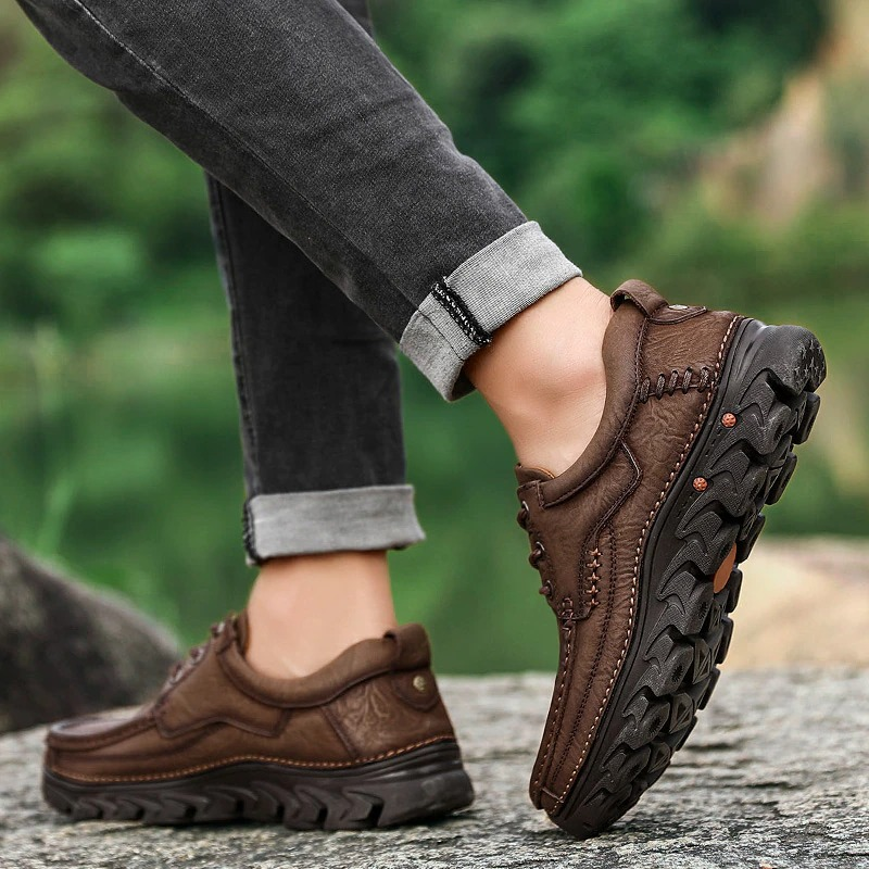 Classic brown leather lace-up shoes for men, perfect for casual or alternative style outfits.