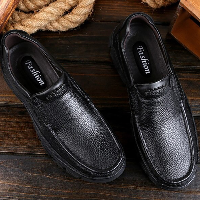 Classic black genuine leather loafers for men, perfect for casual and formal occasions.