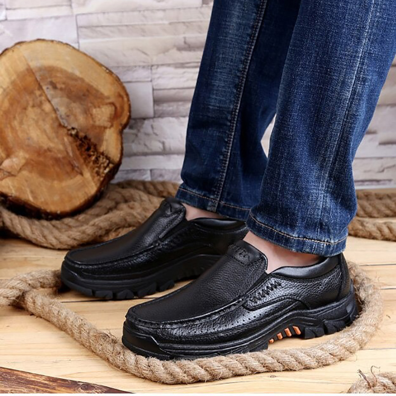 Men's black genuine leather loafers paired with denim, ideal for casual and versatile styling.