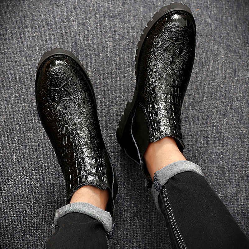 Men's black PU leather ankle boots with textured design, perfect for casual or business outfits.