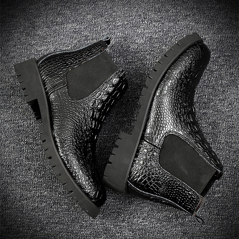 Classic men's black PU leather ankle boots with modern design and textured finish, perfect for casual or business wear.