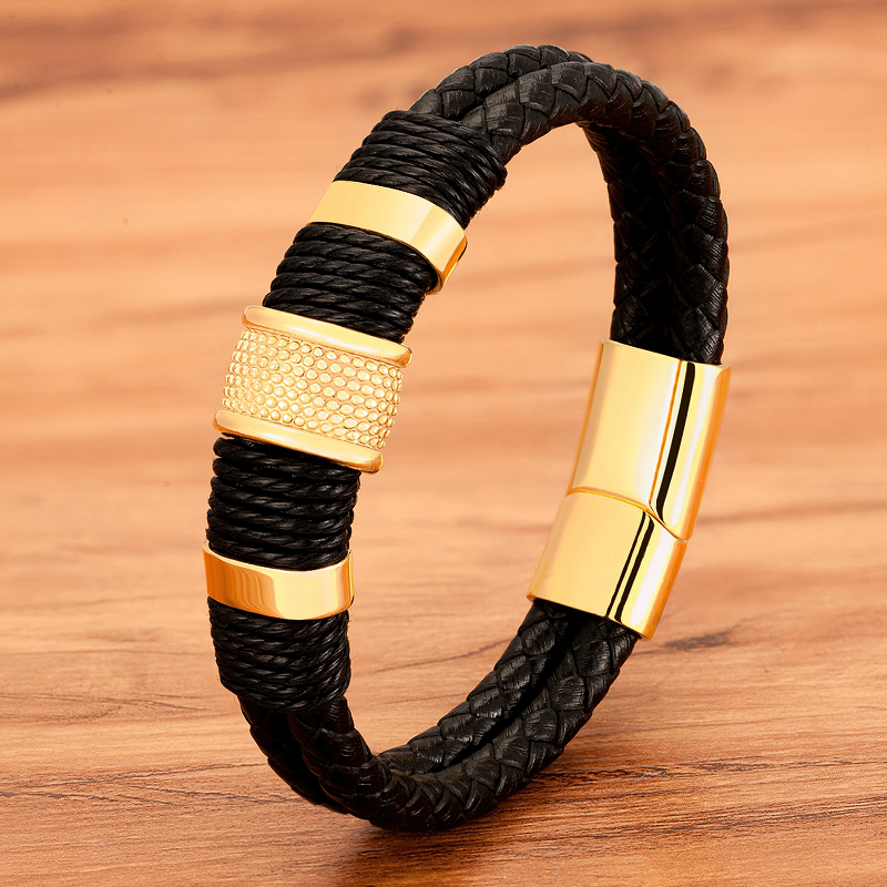 Classic stainless steel men's bracelet with genuine leather, featuring black and gold accents for timeless style.