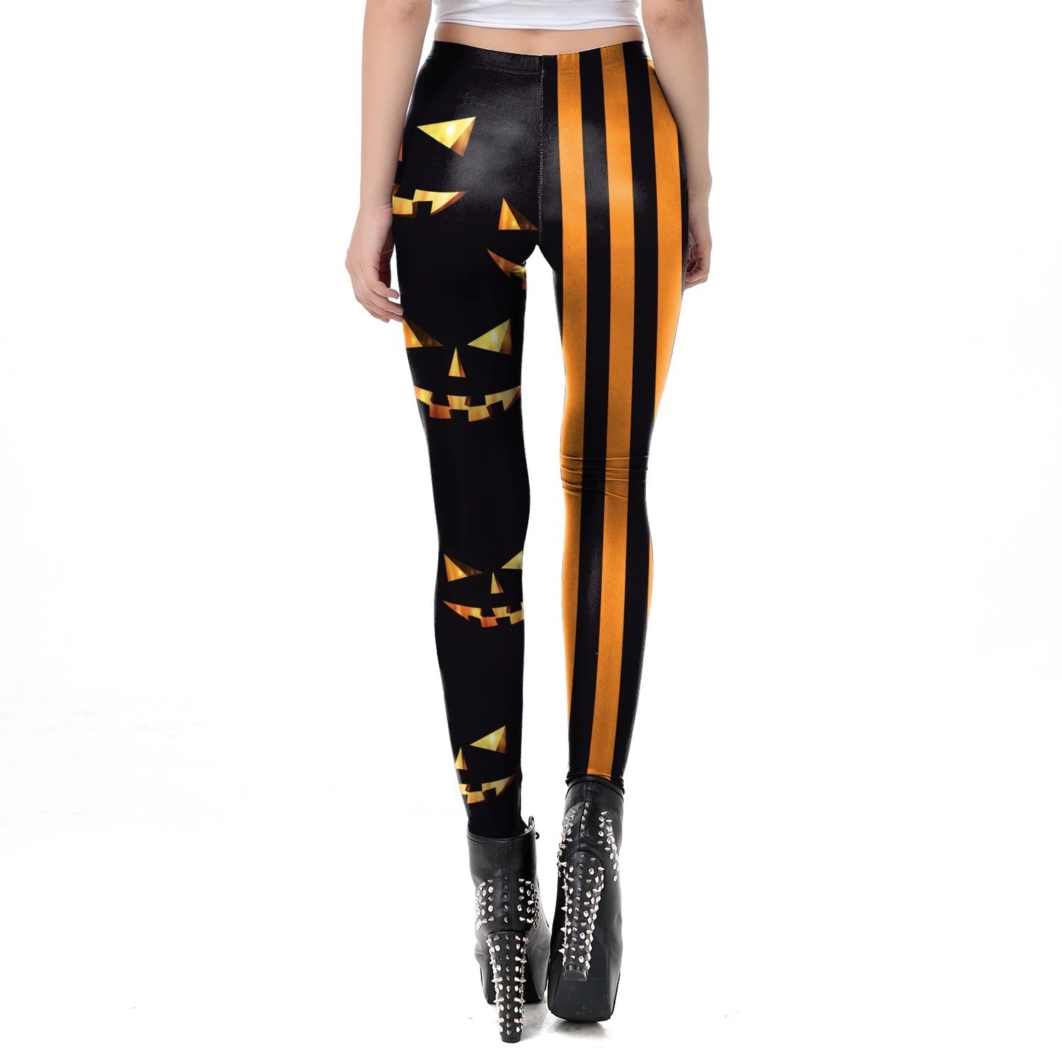 Classic women's Halloween leggings with pumpkin faces and bright stripes, perfect for festive workouts and stylish autumn outfits.