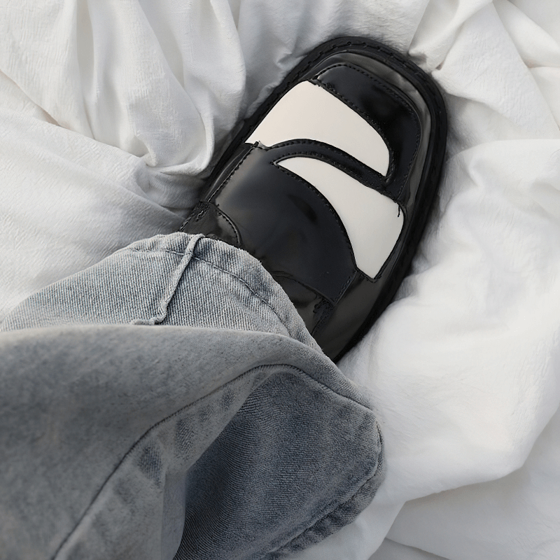 Elegant black and white square toe derby shoe styled with casual denim, adding a retro twist to your outfit.