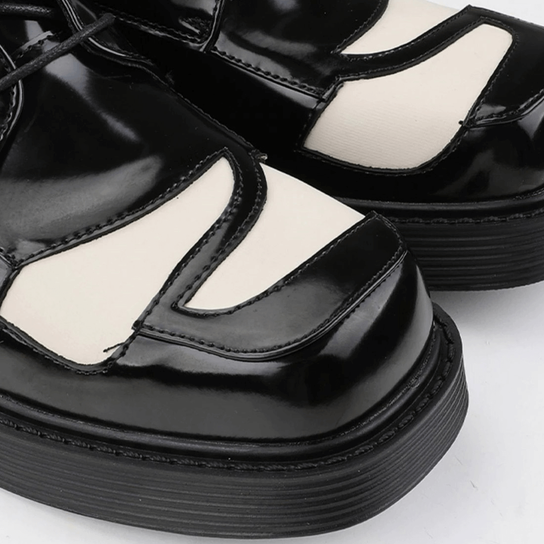 Close-up of black and white Derby lace-up shoes for men, showcasing their retro design and quality materials.