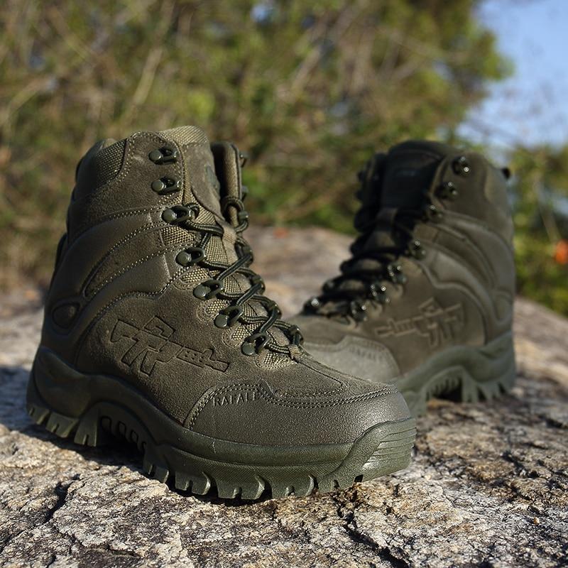 Stylish green combat boots on rocky terrain, perfect for tactical and alternative fashion lovers.