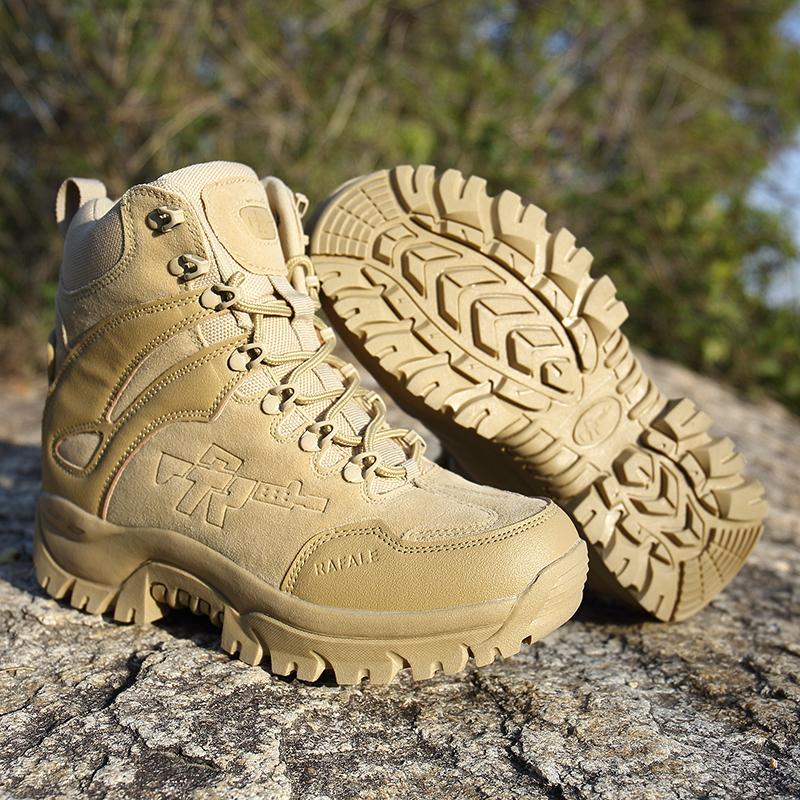 Tan military tactical boots with rugged soles on rocky terrain, perfect for outdoor adventures and alternative fashion.