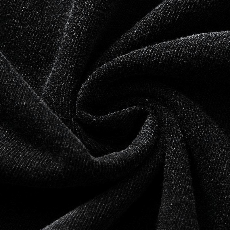 Close-up of soft black cotton fabric, showcasing its texture and flexibility, perfect for casual t-shirts.