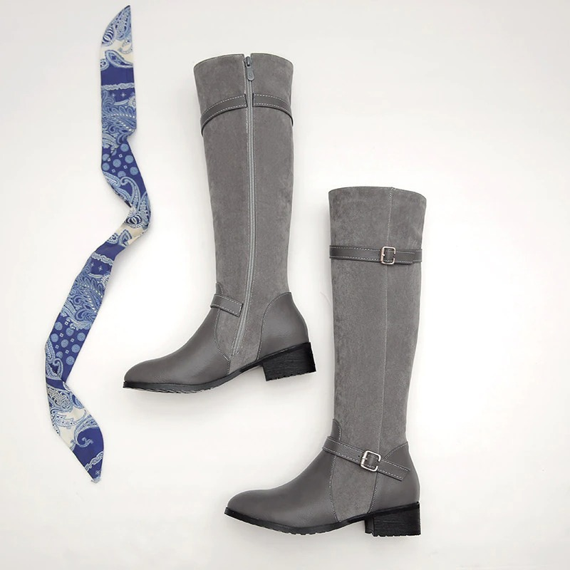 Stylish ladies knee high boots in gray PU leather with a low heel, paired with a blue patterned scarf, perfect for casual wear.