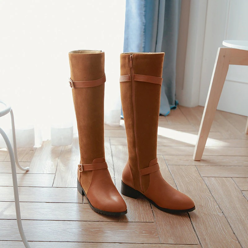 Ladies knee high boots in brown suede and leather, featuring a low heel and stylish buckle for casual wear.