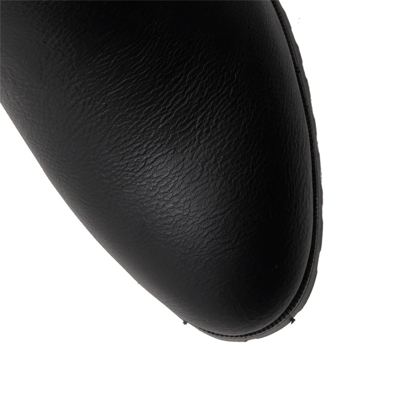 Close-up of black PU leather toe of casual knee high boots for women, perfect for everyday wear.