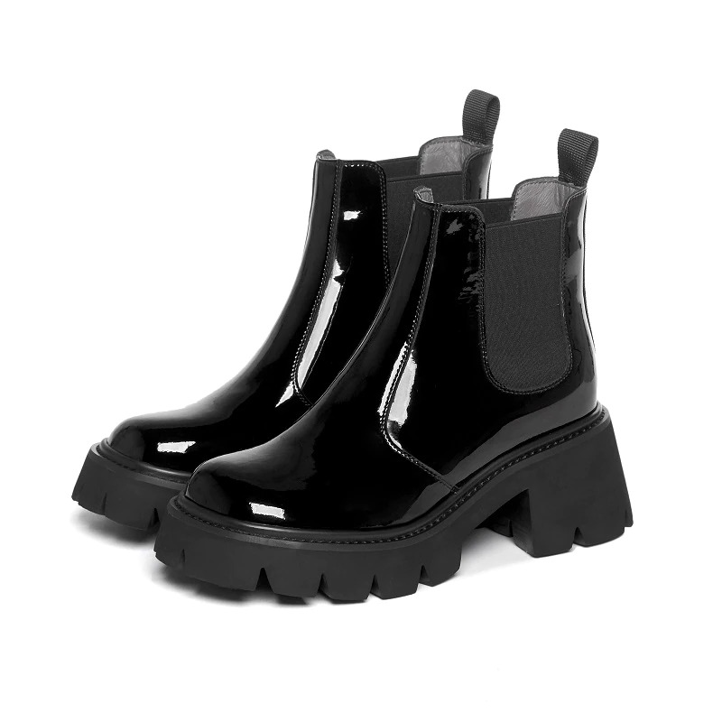 Stylish black square heel women's boots with glossy finish and chunky rubber sole for casual or trendy looks.