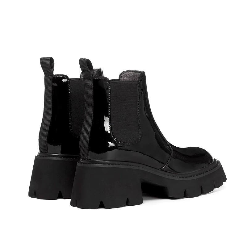 Stylish black square heel platform ankle boots with round toe and elastic side panels.