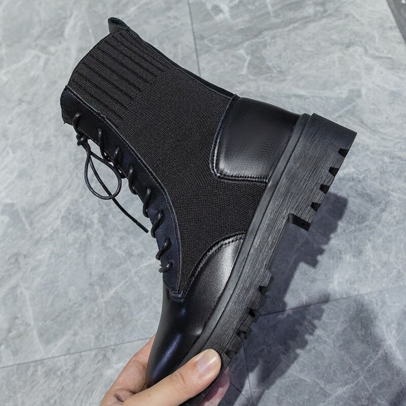 Sleek black lace-up ankle boots with flexible sole, perfect casual footwear for women, offering comfort and style.