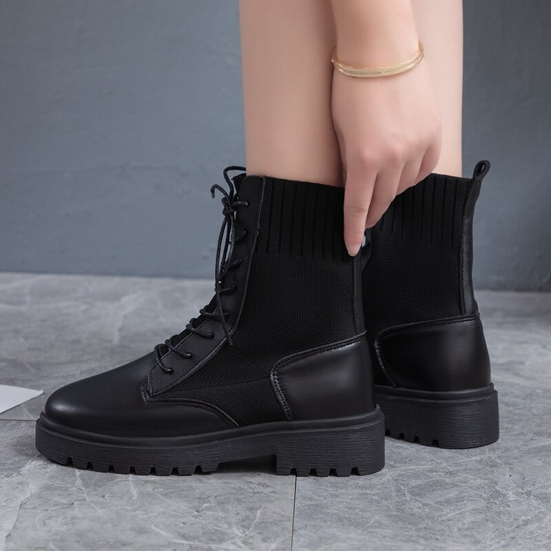 Black lace-up ankle boots for women with a flexible sole, perfect for casual wear and all-day comfort.