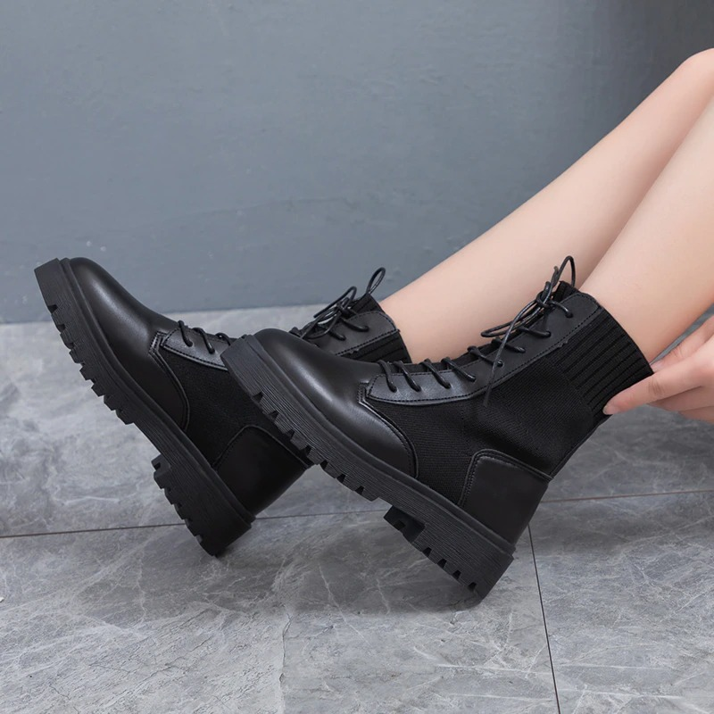Warm lace-up ankle boots for women, featuring a flexible sole and stylish round toe design in black.
