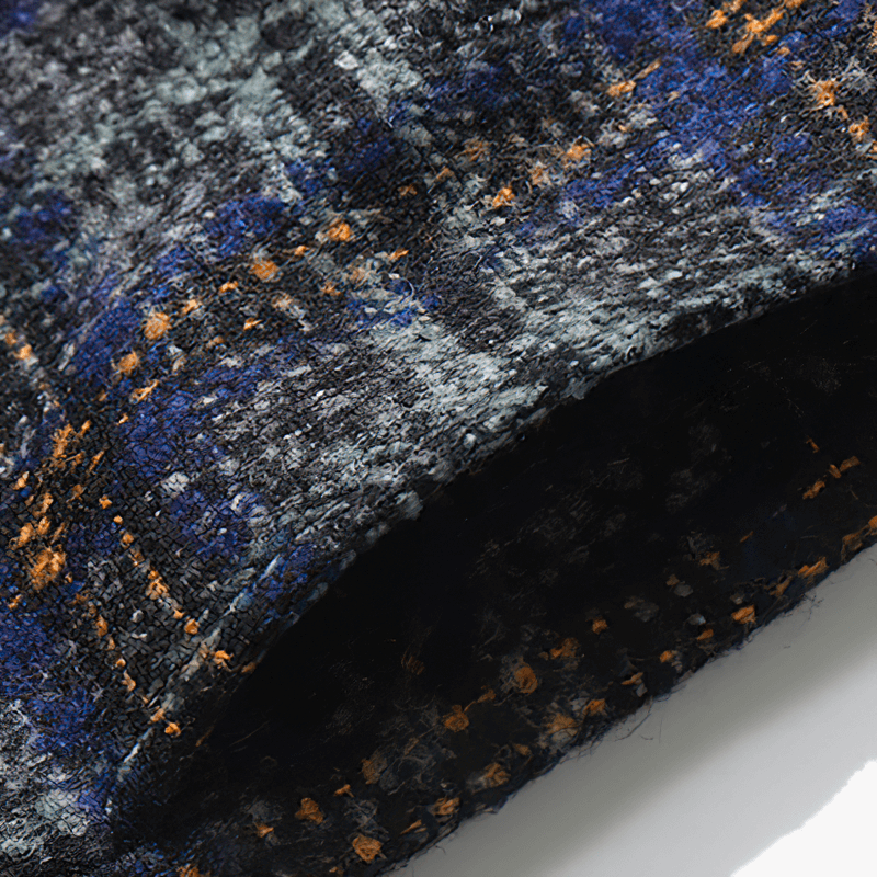 Close-up of a thick woolen plaid fabric in blue, gray, and orange, perfect for a stylish men's casual shirt.