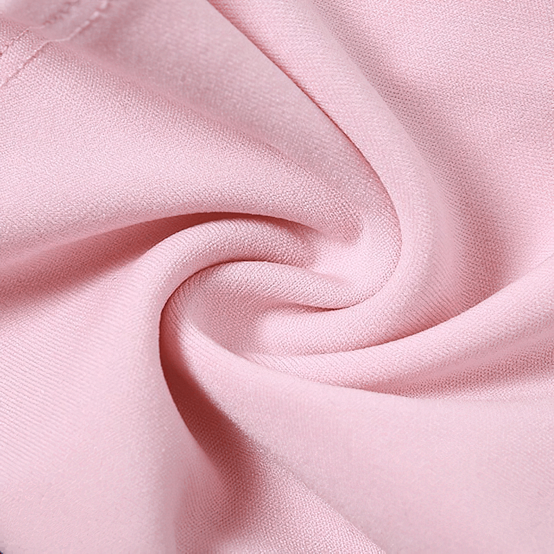Close-up of soft pink fabric, showcasing its smooth texture, perfect for a stylish halter top.