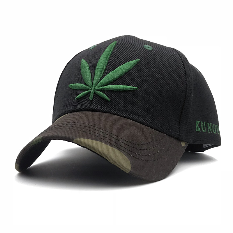 Cool black baseball cap with green leaf embroidery and camouflage visor, stylish and casual headwear for any occasion.