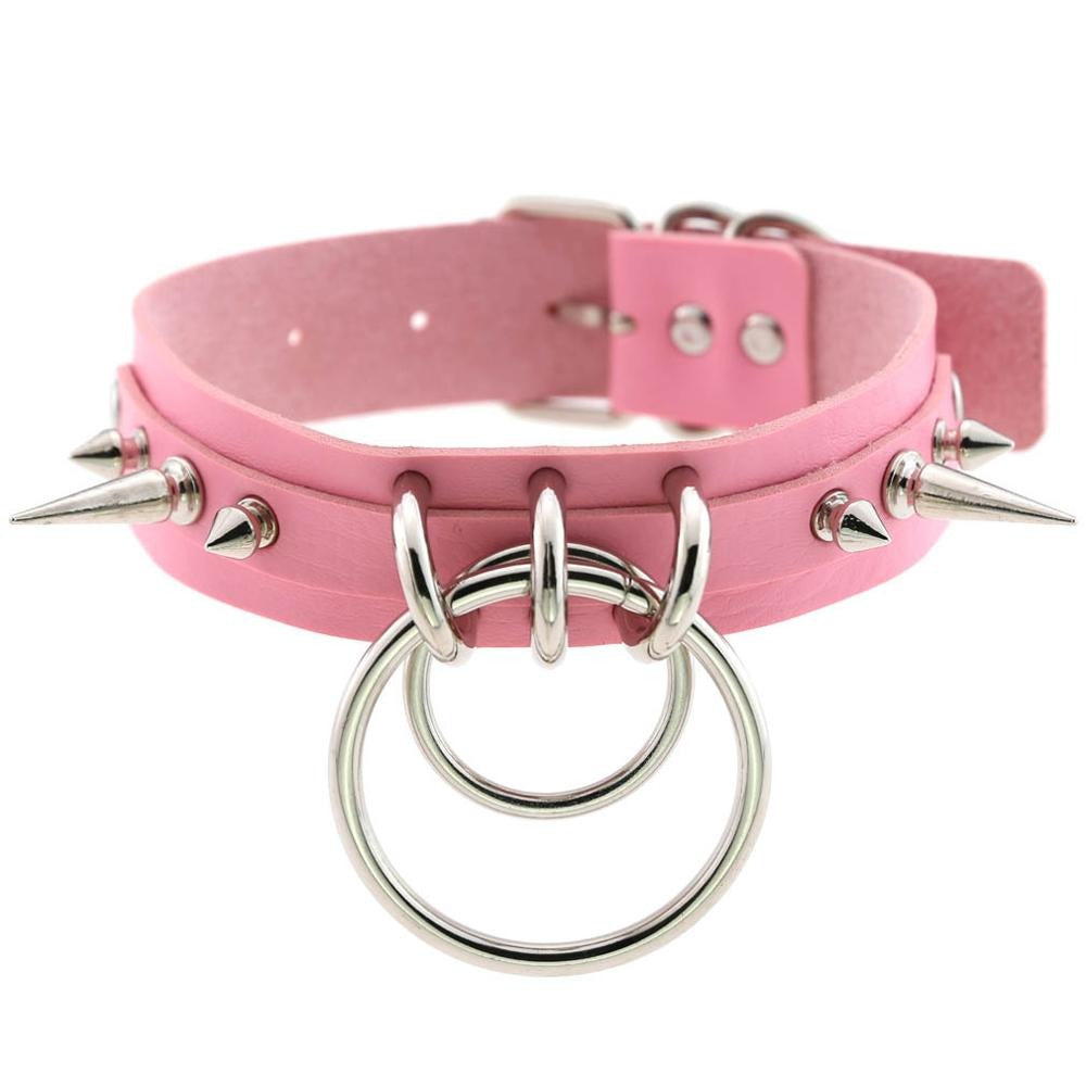Pink choker collar with metal spikes and rings, perfect for gothic fashion accessories and concerts.