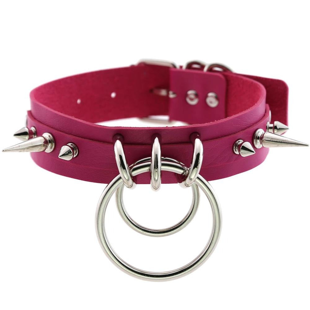 Cool pink Gothic collar choker with metal spikes and rings, perfect for accessorizing edgy outfits.