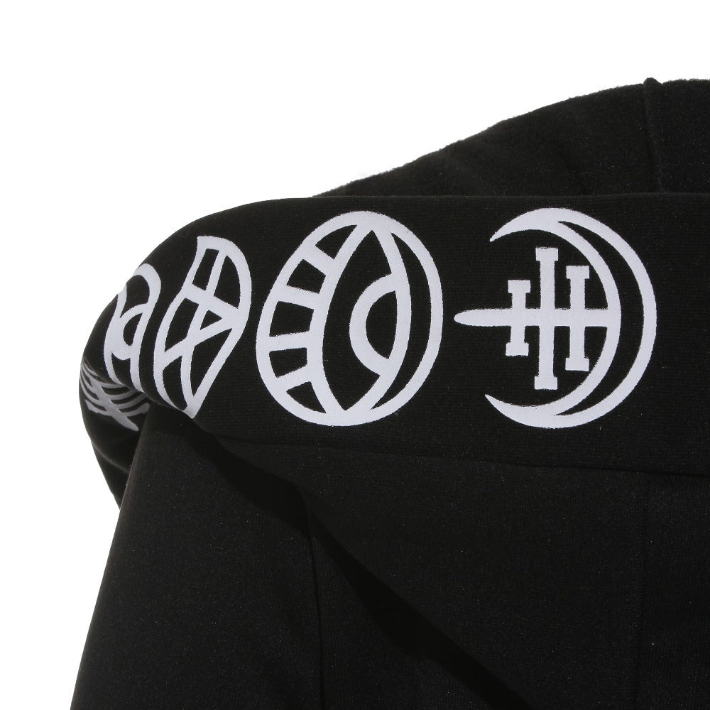 Close-up of the hood detailing on a black cotton gothic coat featuring unique white printed symbols.