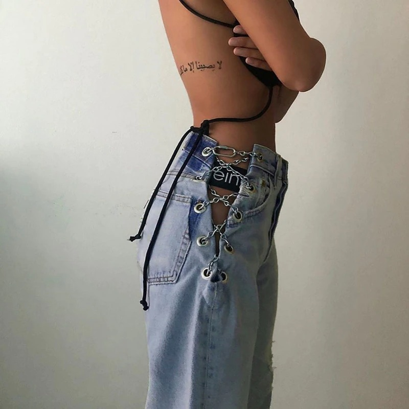 Woman showcasing cool high waist jeans with chains, perfect for casual style and adding a trendy touch to any outfit.
