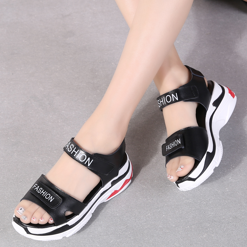 Stylish black split leather platform sandals with white sole, perfect for trendy summer looks.