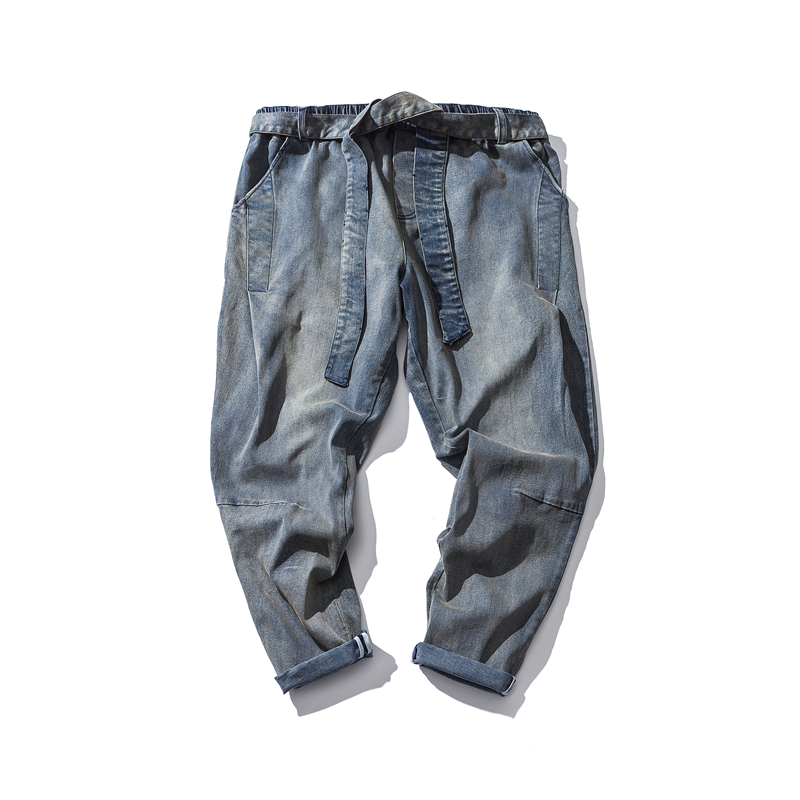 Cool loose jeans for men with an elastic waist and ribbons, perfect for alternative fashion styles.