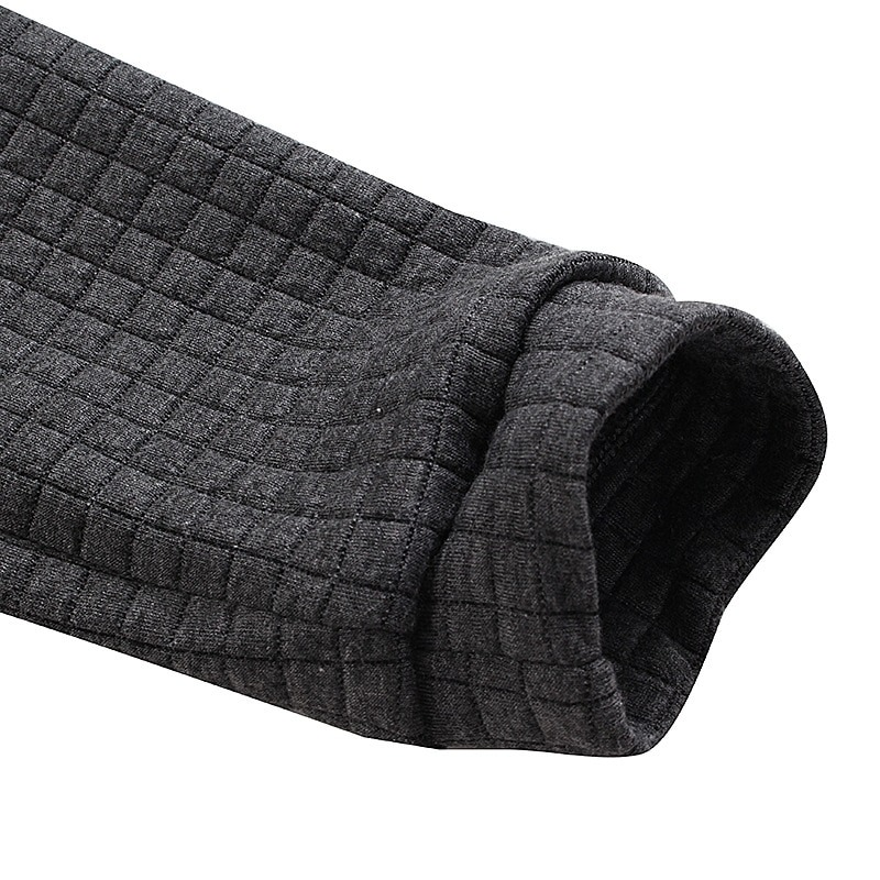 Close-up of the cuff of a gray rock-style men's hoodie in a textured fabric, showcasing comfort and style.