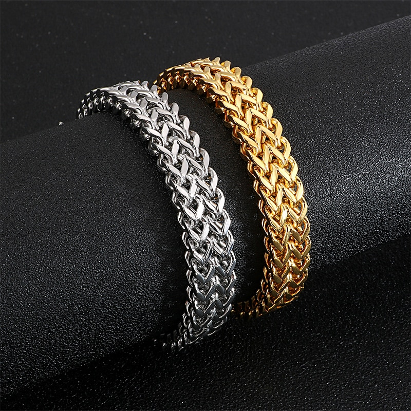 Stylish men's stainless steel bracelet set in silver and gold, showcasing a rock-style chain design, perfect for edgy outfits.