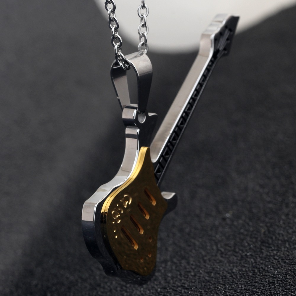 Cool silver guitar necklace pendant with gold detailing, perfect for punk style and alternative fashion.