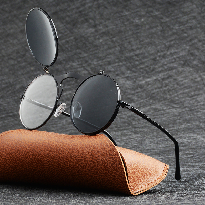 Metal round sunglasses for men and women, stylish retro eyewear on a brown case, providing UV protection.