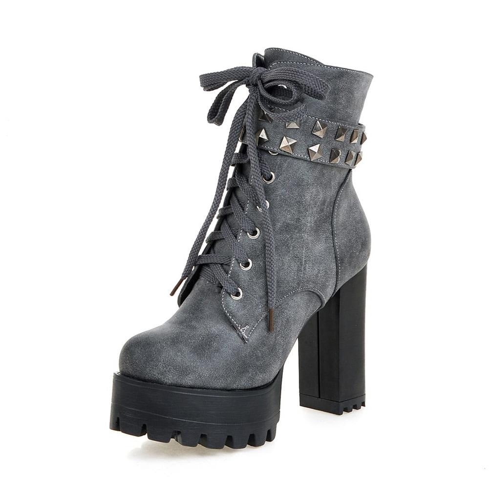 Stylish gray high heel winter boots for women with laces and rivets, perfect for a bold biker look.