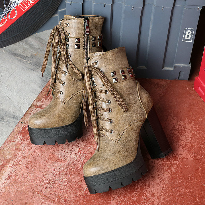 Women's rock-style high heel boots with studs and laces, perfect for a daring biker look this winter.