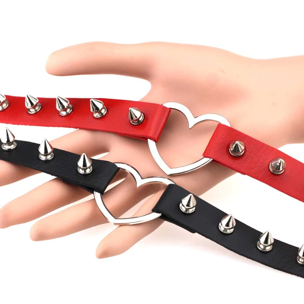 Cool PU leather choker with spikes in red and black, featuring a heart-shaped zinc alloy connector, perfect for gothic style.