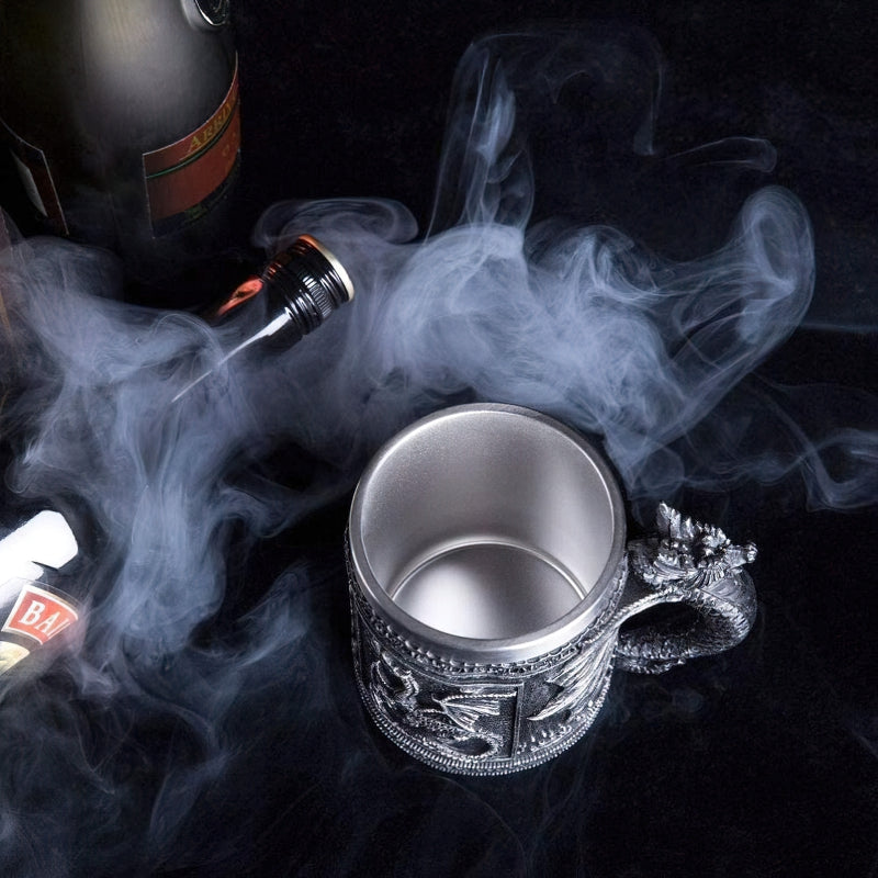 Cool vintage resin and stainless steel beer mug with dragon design, surrounded by smoke, perfect for retro bar settings.