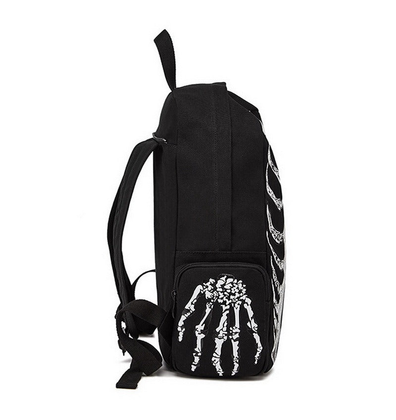 Side view of a cool rock style unisex skeleton printed backpack, perfect for travel and edgy fashion.