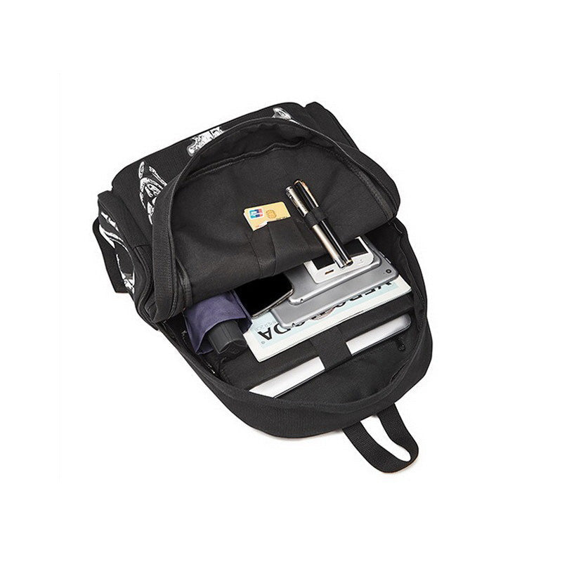 Cool rock style backpack open, revealing spacious interior with pockets for travel essentials and devices.