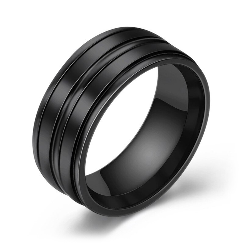 Black stainless steel unisex ring with sleek design and contrasting grooves, perfect for any fashion outfit.