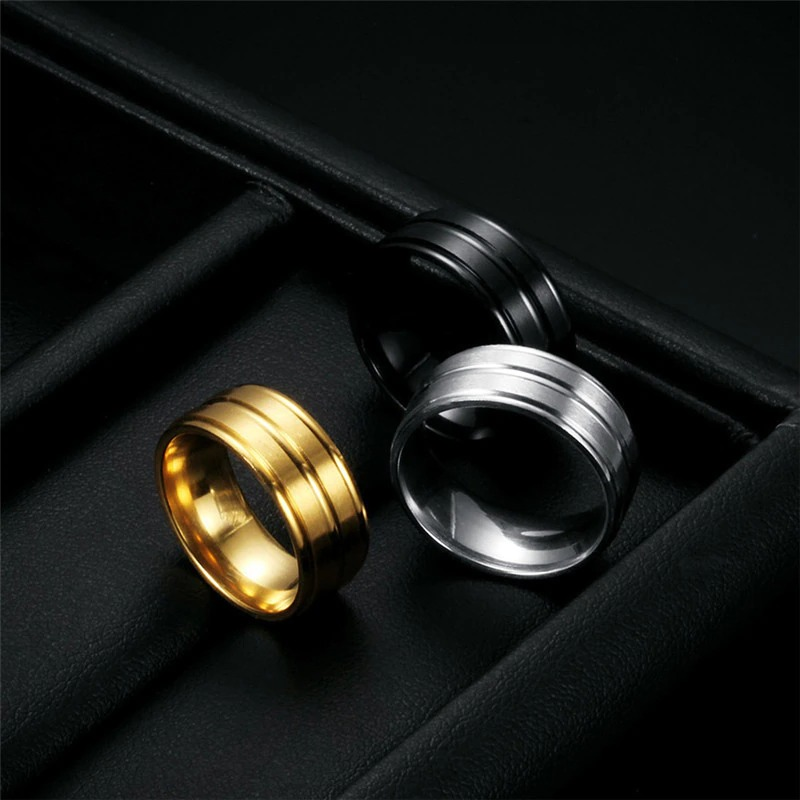 Stylish unisex stainless steel rings in gold, silver, and black, ideal for fashion-forward jewelry lovers.